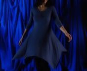 The second video art piece in Kat Parker&#39;s Moving Paintings: Self-Portrait Series. nDirector: Kat Parker; Cinematographer: Caleb Gritskon© Kat Parker 2019nnThis video segment begins as a plain image of Kat standing in front of the camera in a blue dress, slightly flowing in slow motion. The image slowly transforms as triangular pieces of various camera angles emerge from the original image. The effect is that of a broken, but beautiful mirror – ever shifting and changing, but somehow essentia