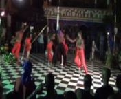 This video was filmed at Lachandèl nightclub in Gonayiv on October 31-November 1st. The nightclub featured Vodouist and folkloric dances by local dance troupes. This performance seems to mimic the Petwo rite with the clacking of the whip at the beginning. After various dance routines, a potomitan (centerpost) is encircled and serves as a kind of maypole around which the dancers weave strands of fabric. This film beautifully illustrates the influence of Vodou culture outside of the Vodou temple