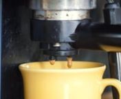 A barkeeper is making coffee with a coffee machine. Its exterior is splotched and dirty, because of long time use. Water runs through the filter and hot drops of the drink fall into a yellow cup.nnDOWNLOAD LINK: http://unripecontent.com/2015/04/09/coffee-machine-making-coffee-free-hd-video-footage/nnDimensions: 1920 x 1080nVideo codec: H.264nColor profile: HD (1-1-1)nDuration: 00:30nFPS: 25