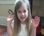 Lydia learns her first hand clapping game!