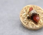 This antique coral brooch is in exquisite condition considering its age, the coral is held securely in the center by the golden ring, and the engravings are crisp and clear, a stunning example of high-end Victorian-era jewelry, a perfect addition to your estate jewelry collection!nnLove this piece, but want to make it more versatile? We here at Market Square Jewelers, along with our master metalsmiths can convert this fantastic brooch into a necklace or pendant for an additional fee. Please cont