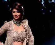 Shilpa Shetty looks like a DIVA in a ruffled pearl-grey lehenga at the Lakme Fashion Week 2018. The actress walked for designer Jayanti Reddy in a silver, intricately embroidered lehenga. Shilpa styled her hair in a loose bun with flowers to give her that sophisticated look and made a bold statement with a choker neckpiece. It was the visually dramatic and playful ruffles on the dupatta and the edgy jacket that elevated the look entirely. Watch the video to know her complete look.