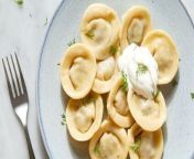 Pelmeni are small pouches of dough often found stuffed with ground beef, finely chopped onions, and sometimes warm spices like cumin.