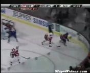 This might not just be a great hockey save, this might be the GREATEST hockey save! He sends the puck airborne and then swats it away before it slips in the net!