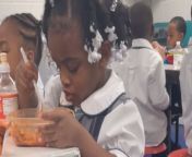 In the school cafeteria, this little girl was head-over-heels in love with spaghetti.&#60;br/&#62;&#60;br/&#62;With each twirl of her fork, she&#39;s transported to a world of savory delight, completely oblivious to the chatter of her classmates.&#60;br/&#62;&#60;br/&#62;Her eyes sparkled with joy as she savored every bite, lost in the delicious tangle of noodles and sauce.&#60;br/&#62;&#60;br/&#62;Suddenly, she noticed her mother discreetly recording her messy spaghetti affair, and a mischievous grin spread across her face. &#60;br/&#62;&#60;br/&#62;She knew she had been caught red-handed, but she couldn&#39;t be happier—after all, what&#39;s a love for spaghetti without a little mess?&#60;br/&#62;Location: Douglasville, United States&#60;br/&#62;WooGlobe Ref : WGA589042&#60;br/&#62;For licensing and to use this video, please email licensing@wooglobe.com