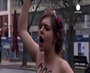 Three members of the women&#39;s rights group Femen stage anti-Sochi Games protest in front of the Russian embassy in Berlin.