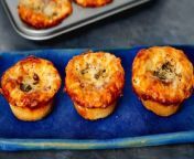 Ditch waiting in line and make these delicious pizza bites from the comfort of your own home! In this video, the Allrecipes team shows you how to make a copycat recipe for Little Caesars Crazy Puffs. With the assistance of a muffin tin, a secret seasoned sauce, an herby butter, and plenty of cheese, you can enjoy these bite-sized appetizers in under 30 minutes. Watch the video to learn how to bake these saucy snacks.
