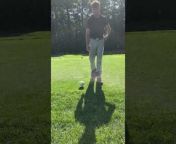 This guy attempted a golf trick shot on the golf course. He flipped the club over his shoulder, causing the golf ball to strike the club and destroy it.